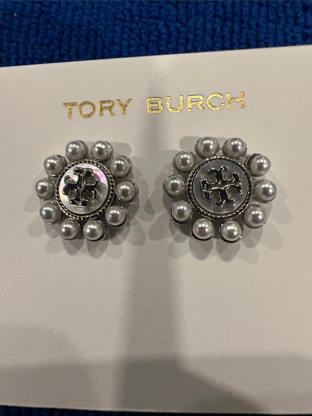 Tory Burch Kira Pearl Flower Stud Earrings, featuring a central Double T logo